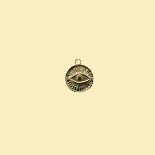 Round charm with eye