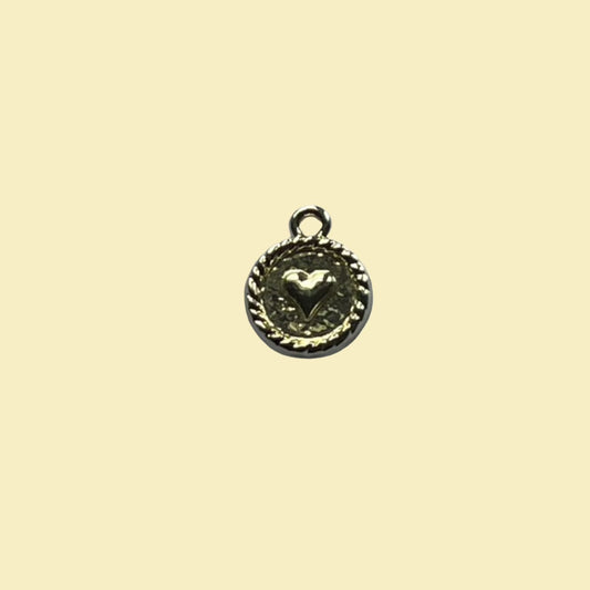 Round charm with heart